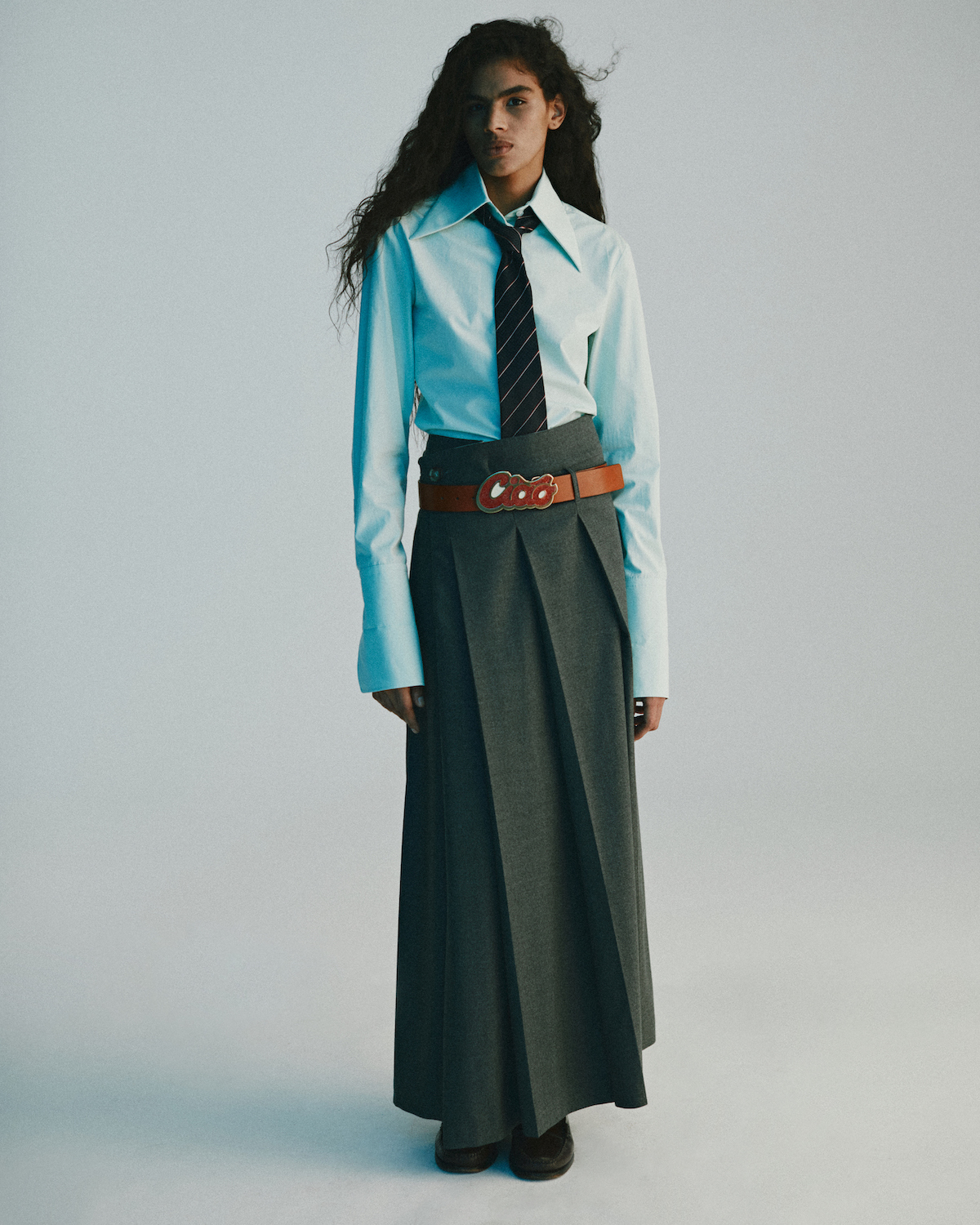 Shirt, skirt, belt by SPORTMAX, necktie by LOUIS VUITTON, shoes by SEBAGO