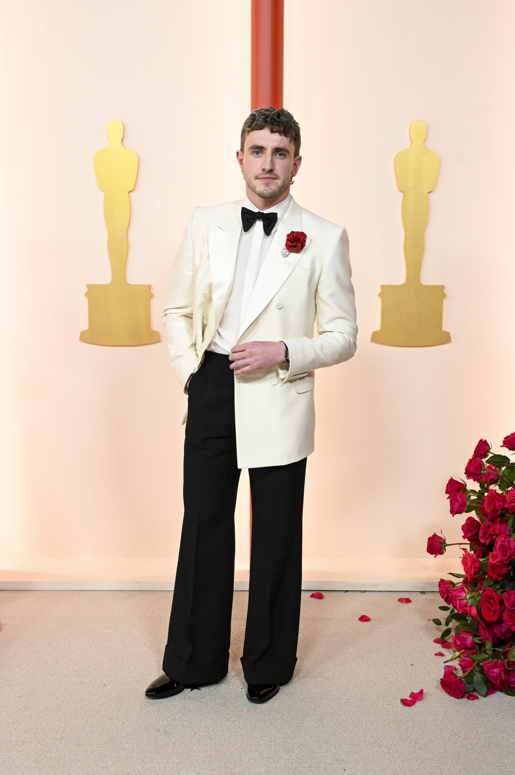Paul Mescal, nominated for Best Actor in a Leading Role for ‘Aftersun,’ wore a custom Gucci ivory double-breasted tuxedo jacket, white evening shirt, black bowtie, and black patent leather lace-ups.