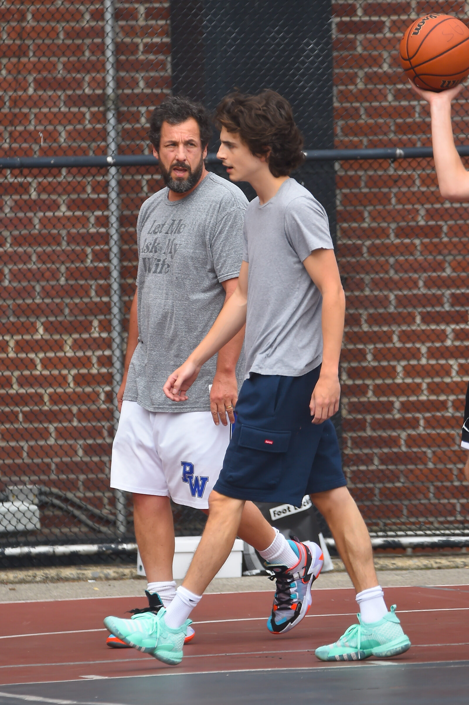 Timothee Chalamet and Adam Sandler are seen playing basketball in Soho on July 20, 2023 in New York City. (Photo by Raymond Hall/GC Images)