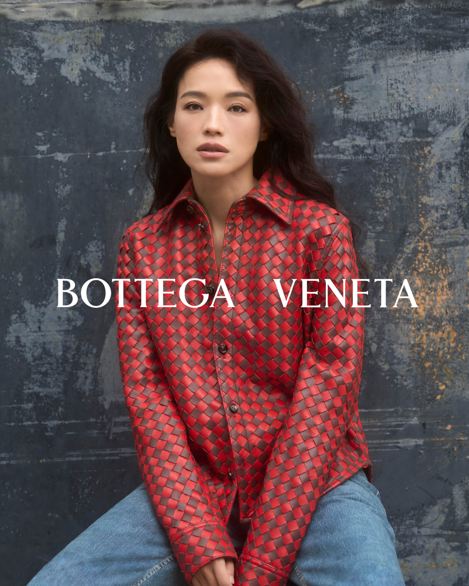 Shu Qi exudes effortless elegance in a vibrant red Bottega Veneta look, showcasing the brand's signature craftsmanship.