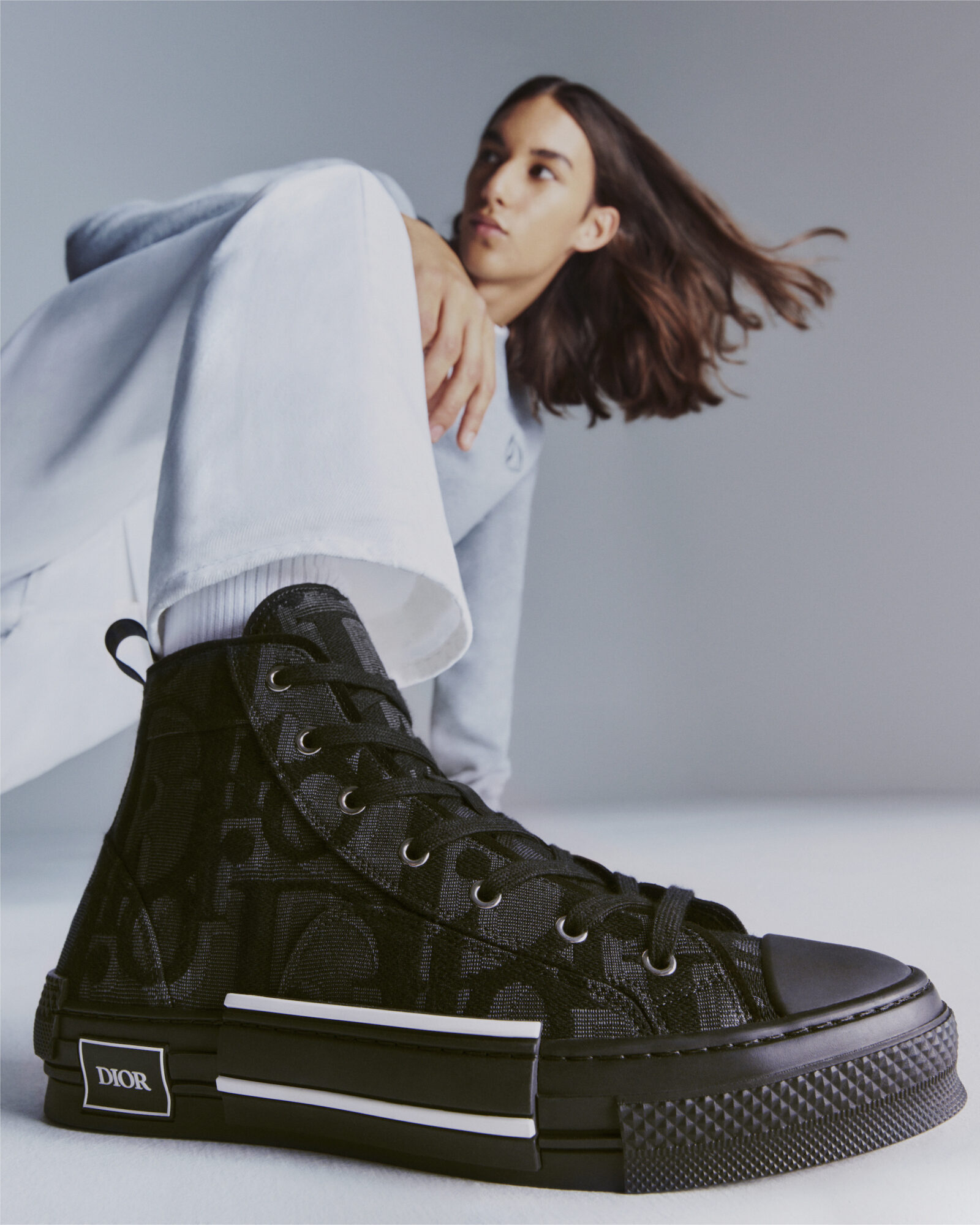 The iconic DIOR B23 sneaker featuring the Maxi DIOR Oblique pattern, illustrating the brand's signature blend of luxury and streetwear.