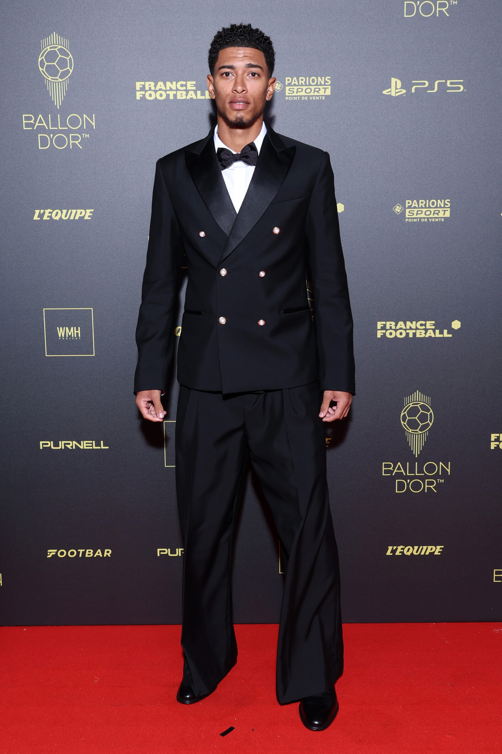 Jude Bellingham, epitomizing elegance in a custom Louis Vuitton double-breasted suit, graces the 2023 Ballon d’Or® ceremony. (Photo by Pascal Le Segretain/Getty Images)