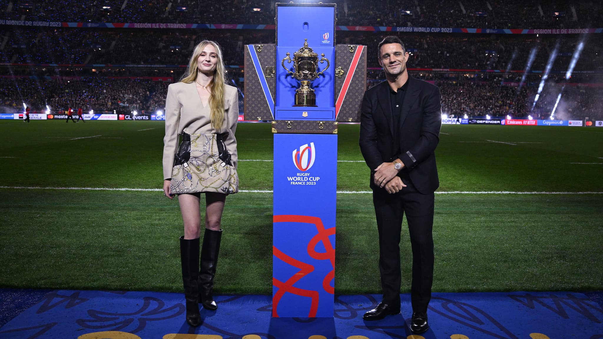 Dan Carter and Sophie Turner present the Webb Ellis Cup in its Louis Vuitton Trophy Trunk at the Rugby World Cup France 2023