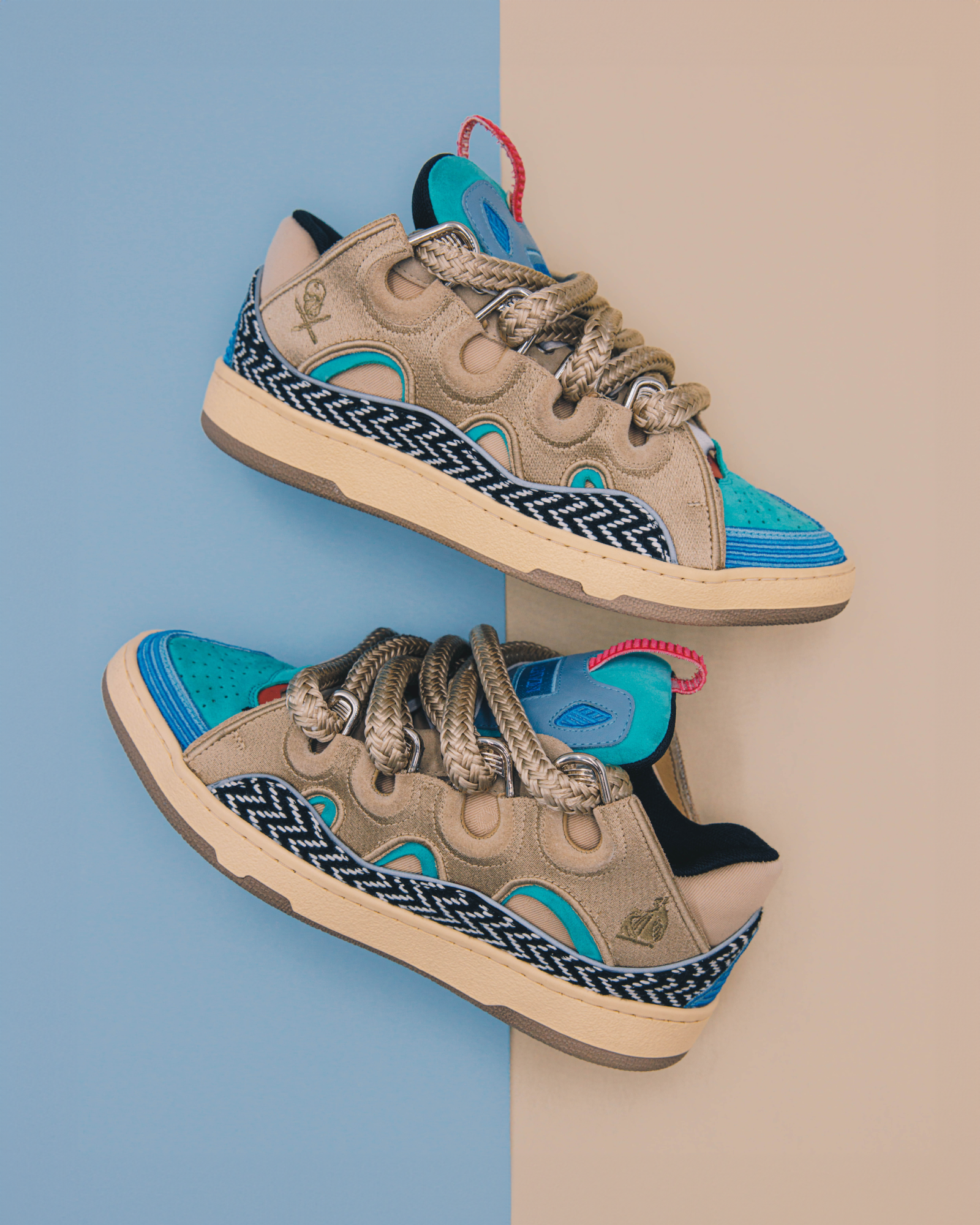 Detail-oriented craftsmanship of the CURB sneaker collaboration: vibrant blues paired with earthy tones, intertwined laces, and a touch of LA's edgy street style.