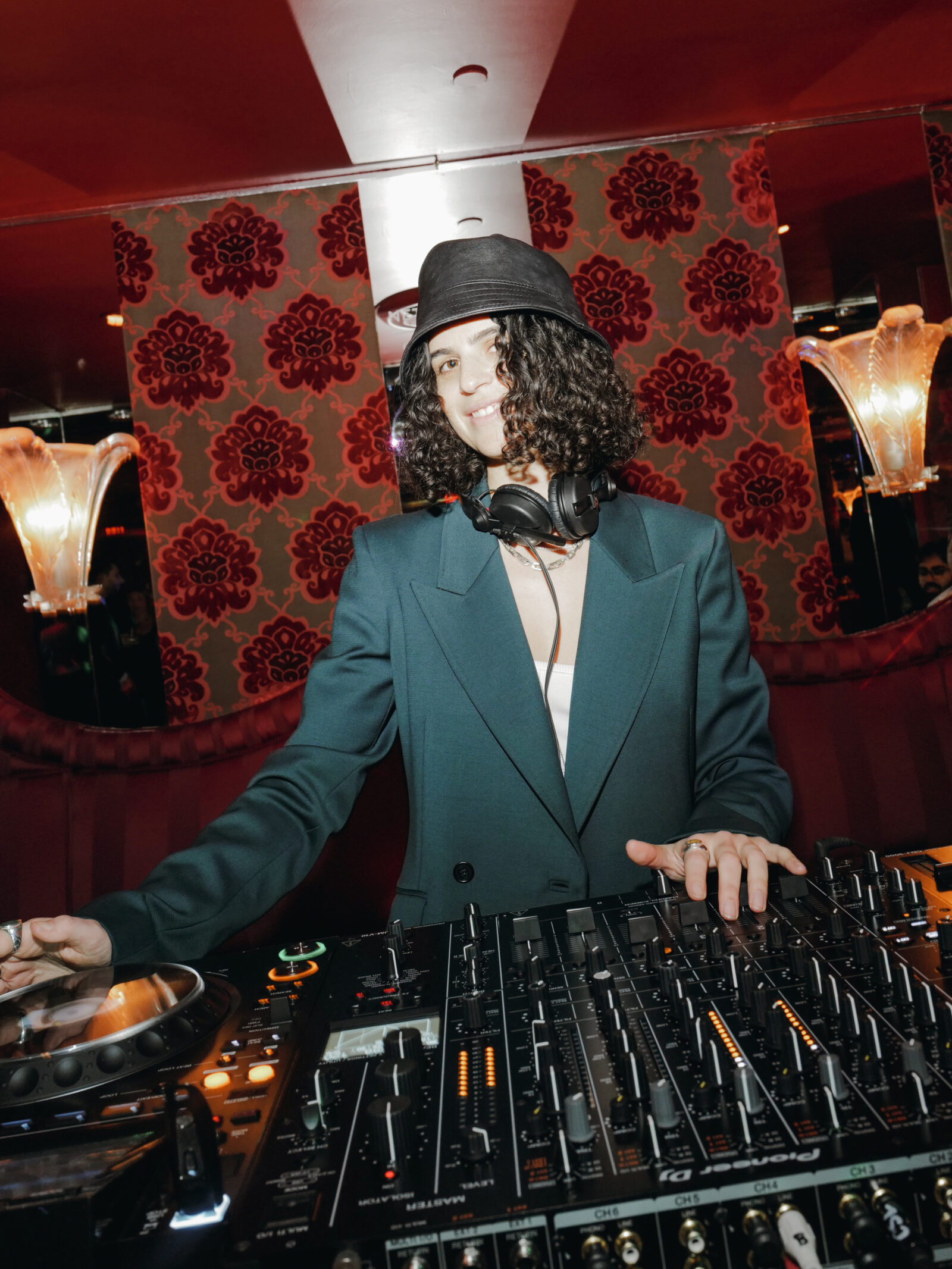 DJ Carlita mixes vibrant beats at The Doubles Club, adding an electrifying soundtrack to the NET-A-PORTER and Gabriela Hearst exclusive collection launch.