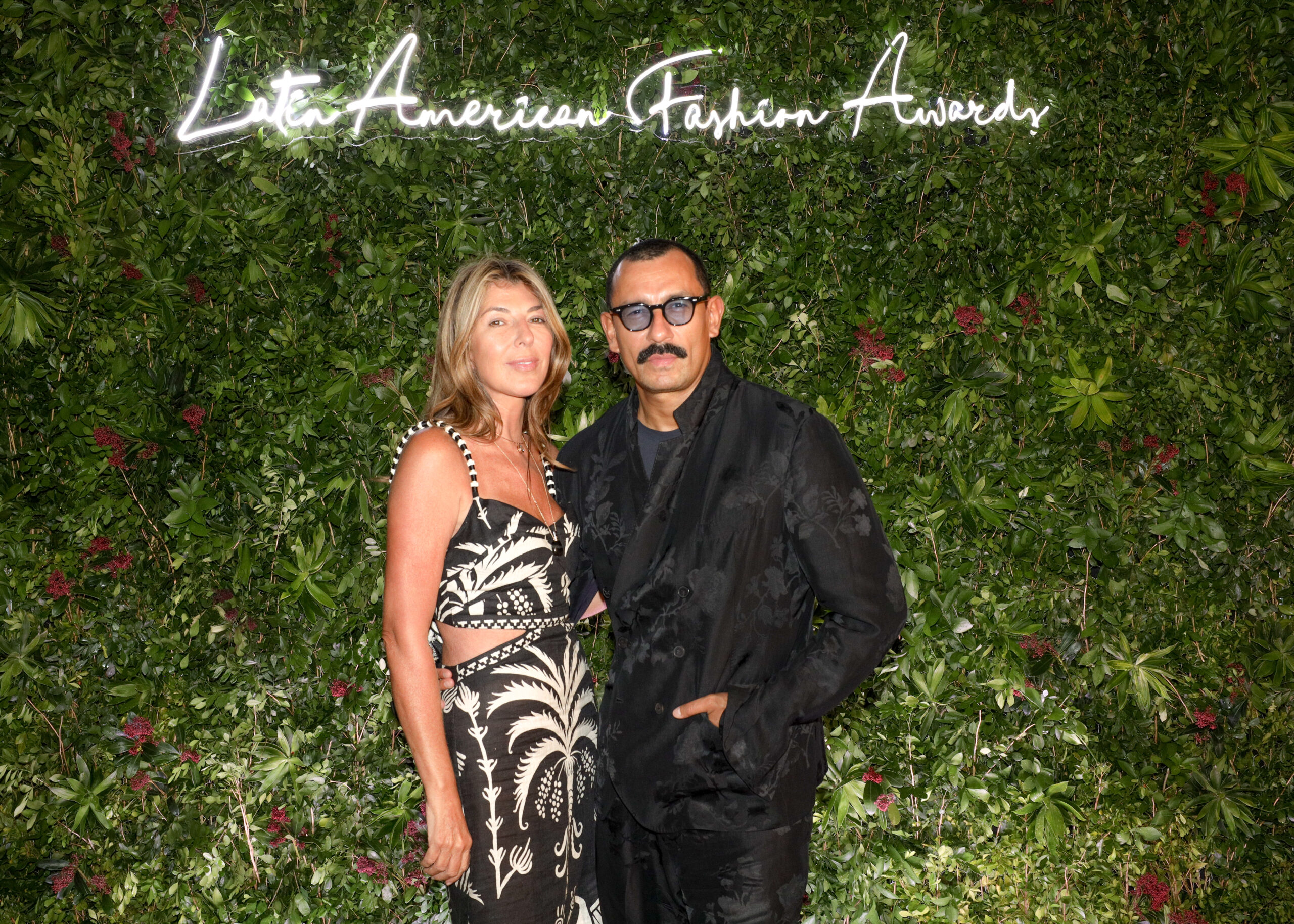 Style icons unite: Nina García and Haider Ackermann grace the verdant backdrop of the Latin American Fashion Awards, embodying the spirit of innovation and elegance in the world of fashion.