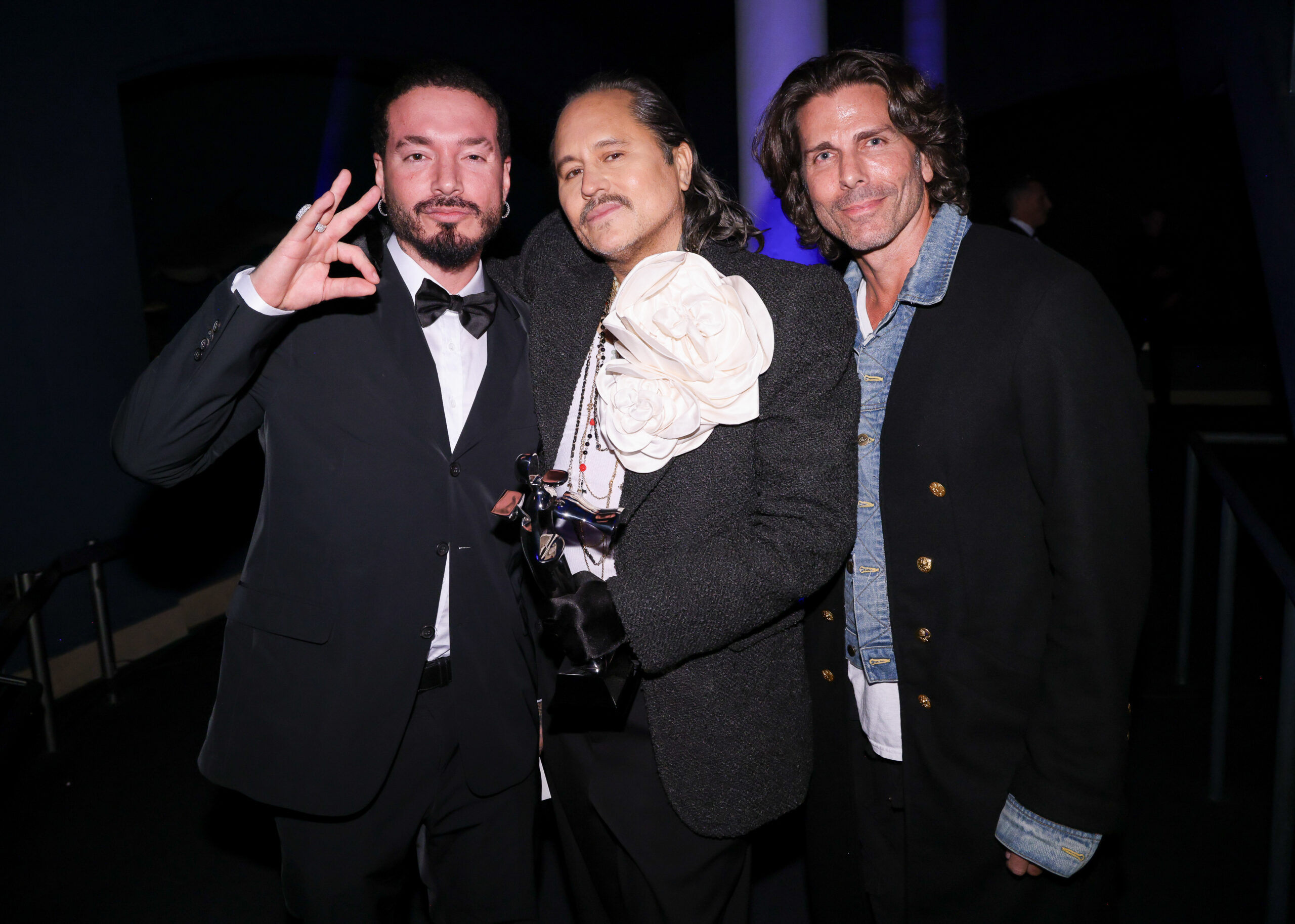J Balvin, Willy Chavarria, and Greg Lauren share a candid moment, reflecting the camaraderie and eclectic spirit of the fashion world at the CFDA Fashion Awards.