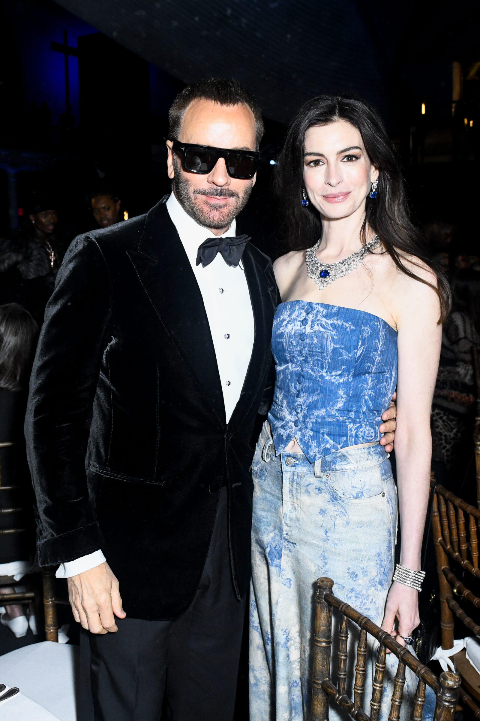 Elegance and style at the CFDA 2023: Designer Tom Ford and actress Anne Hathaway captivate in evening attire.