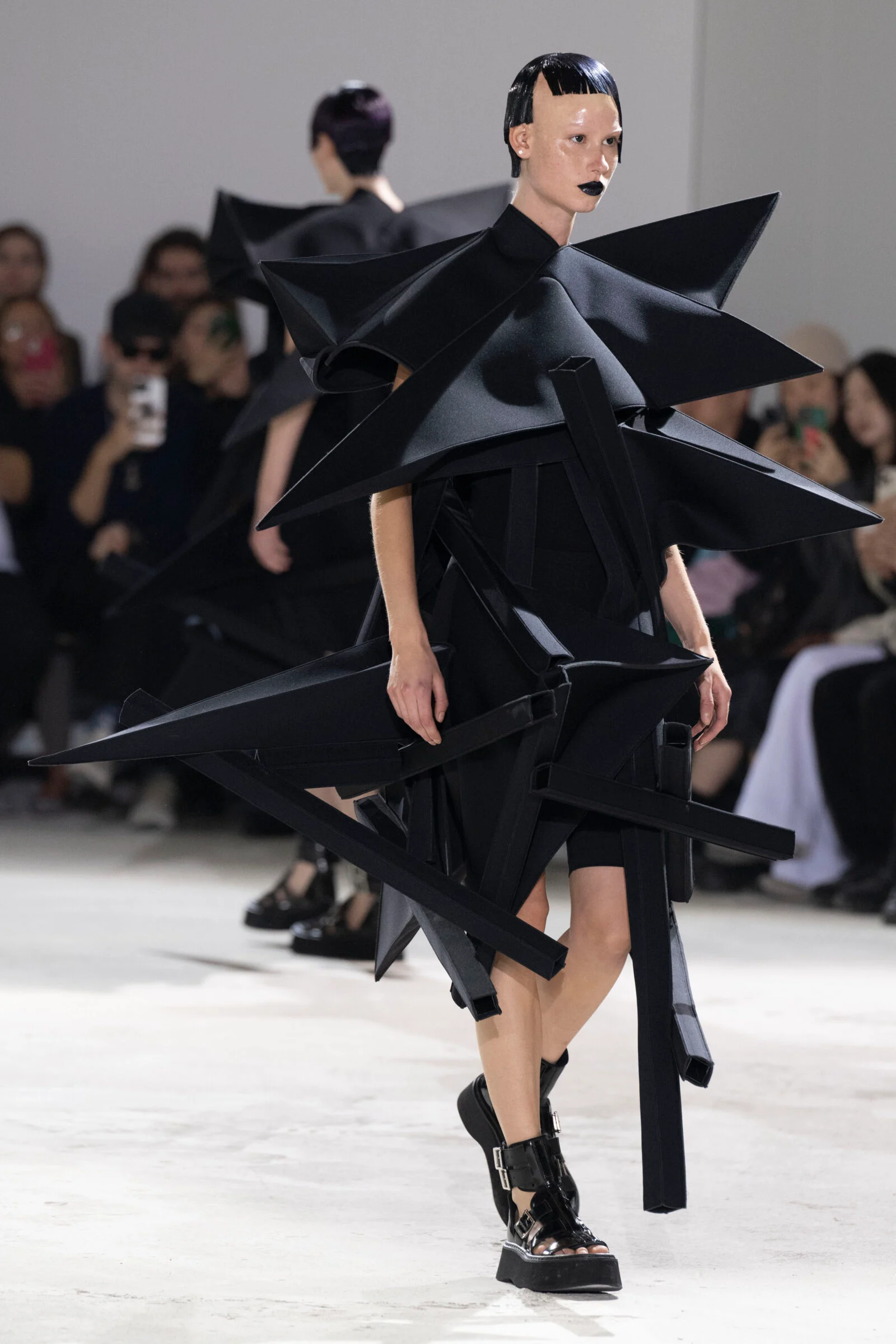 A Junya Watanabe creation breaks the mold, setting a new standard for avant-garde aesthetics in the industry.
