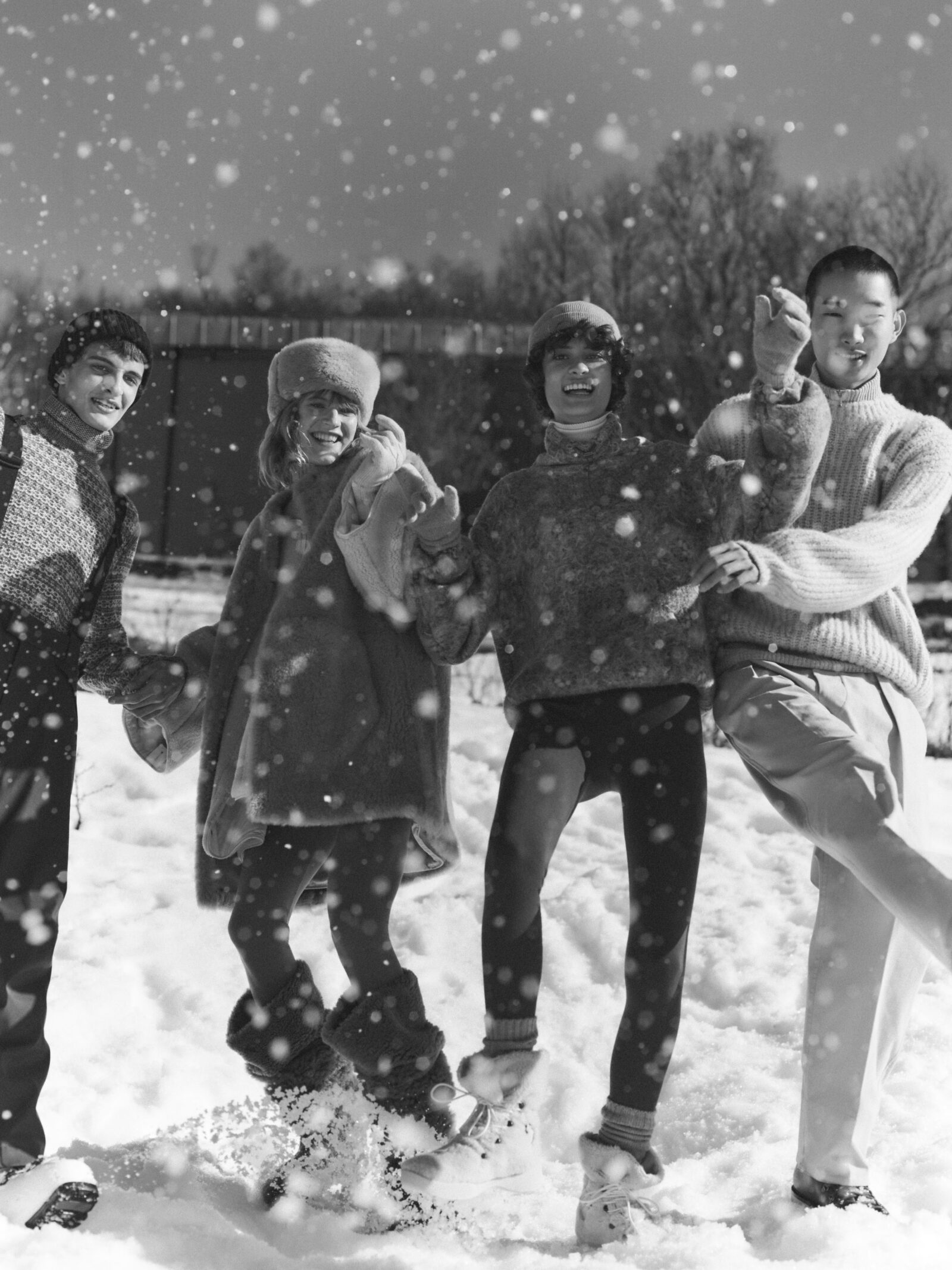 Joyful moments in the snow with Loro Piana's Holiday Collection, as models exhibit the brand's commitment to luxury, warmth, and festive refinement.