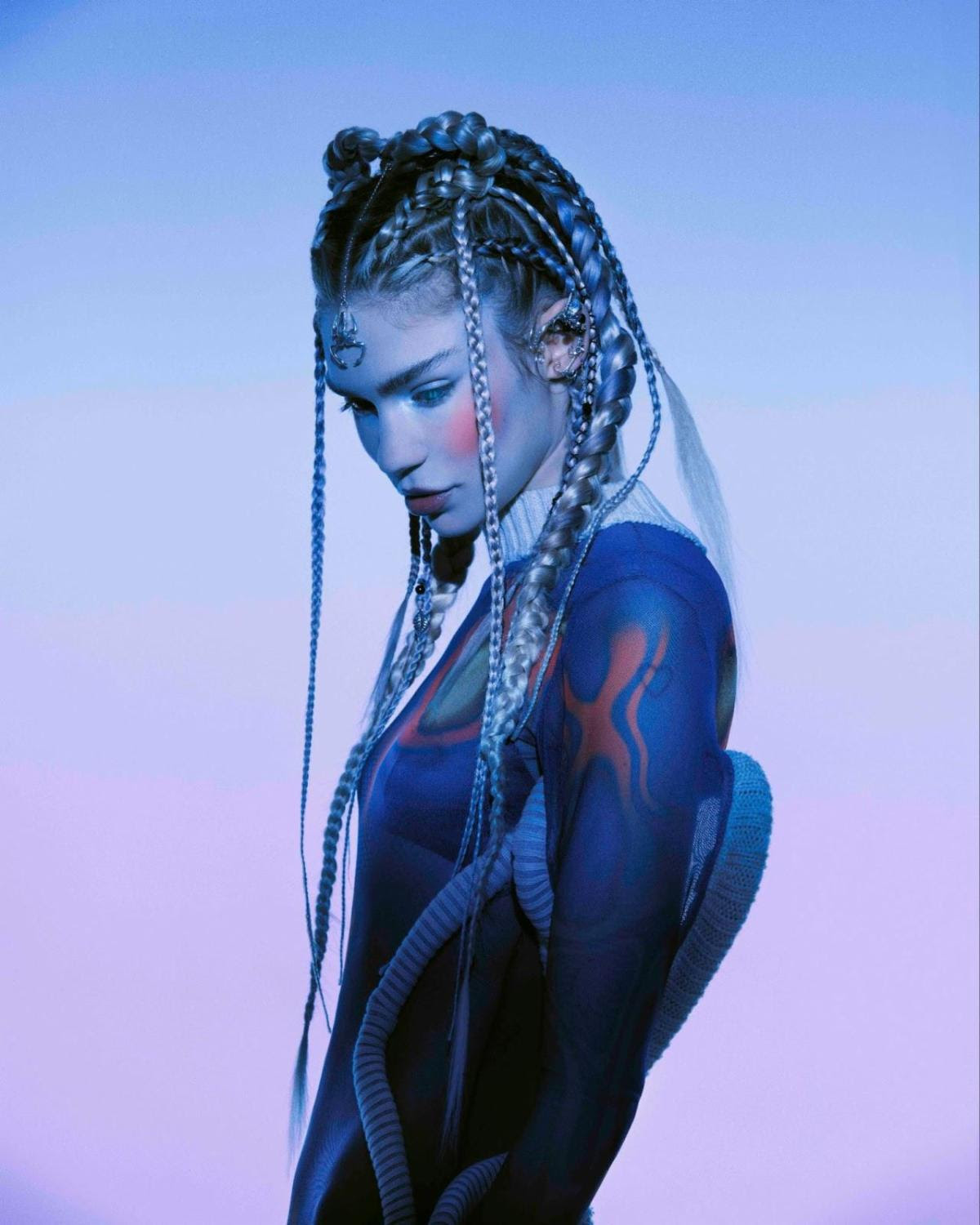 Grimes in ethereal allure, echoing the transcendent collaboration with Sevdaliza in 'Nothing Lasts Forever'.