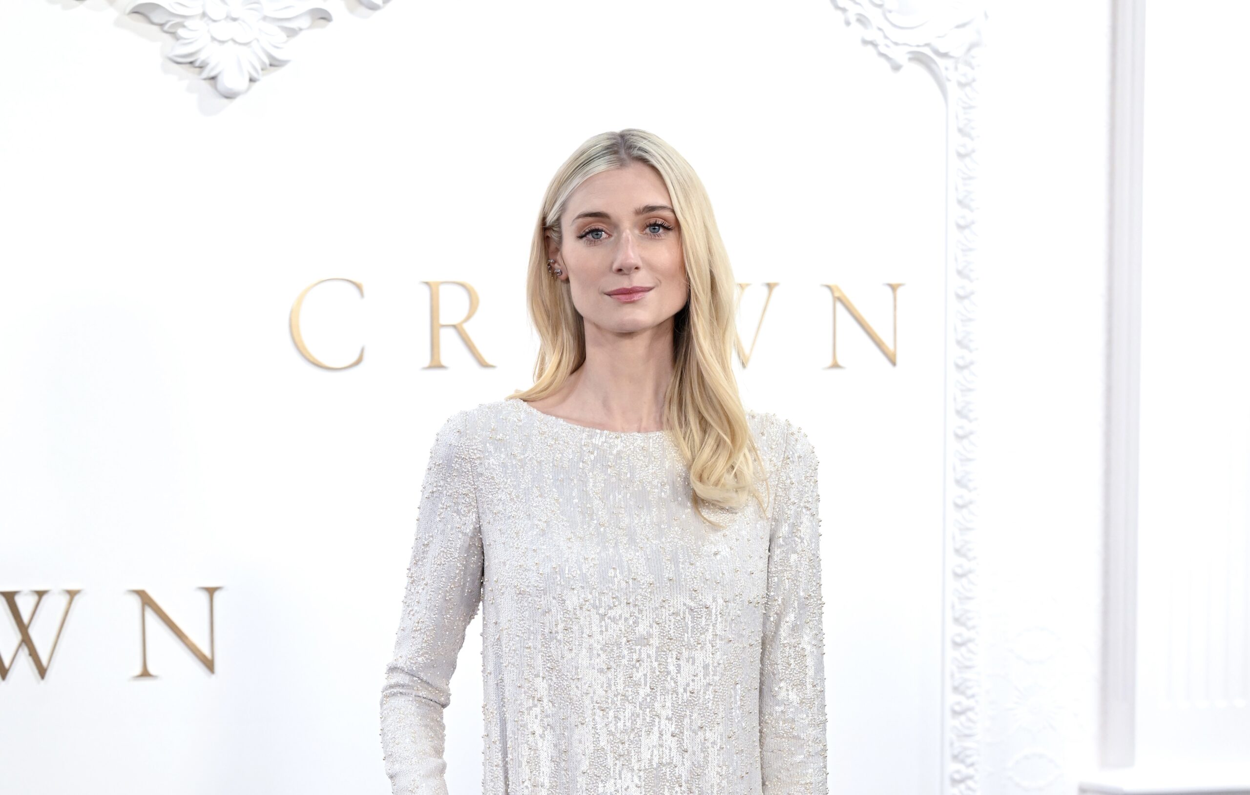 Elizabeth Debicki at 'The Crown' Finale Celebration in London, wearing a sequined, full-length gown that radiates with every step.