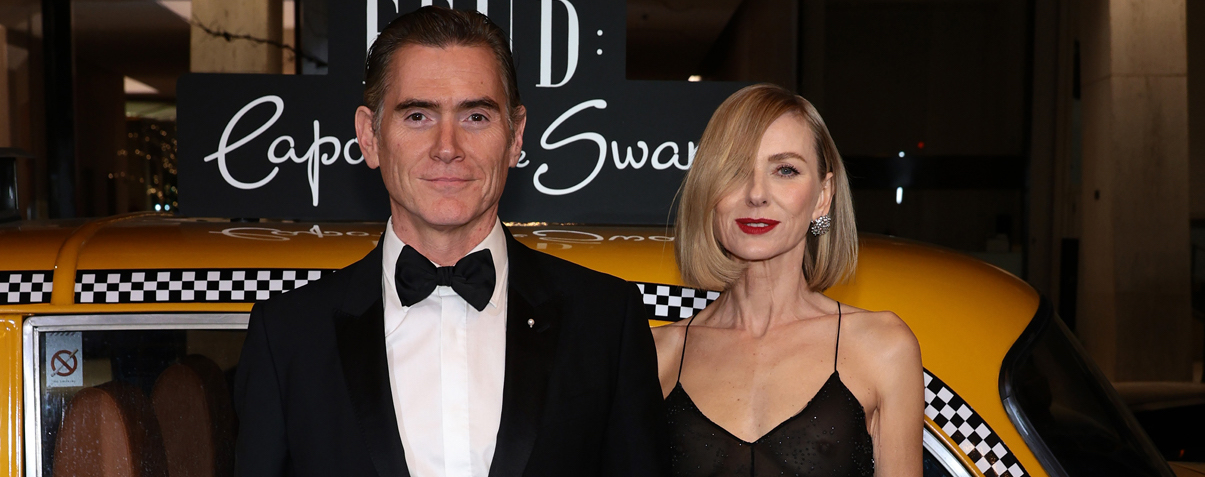 At the opulent New York Premiere After Party for FX's "Feud: Capote VS. The Swans," Billy Crudup and Naomi Watts exude classic Hollywood glamour, posed before an iconic yellow cab installation at The Plaza Hotel.