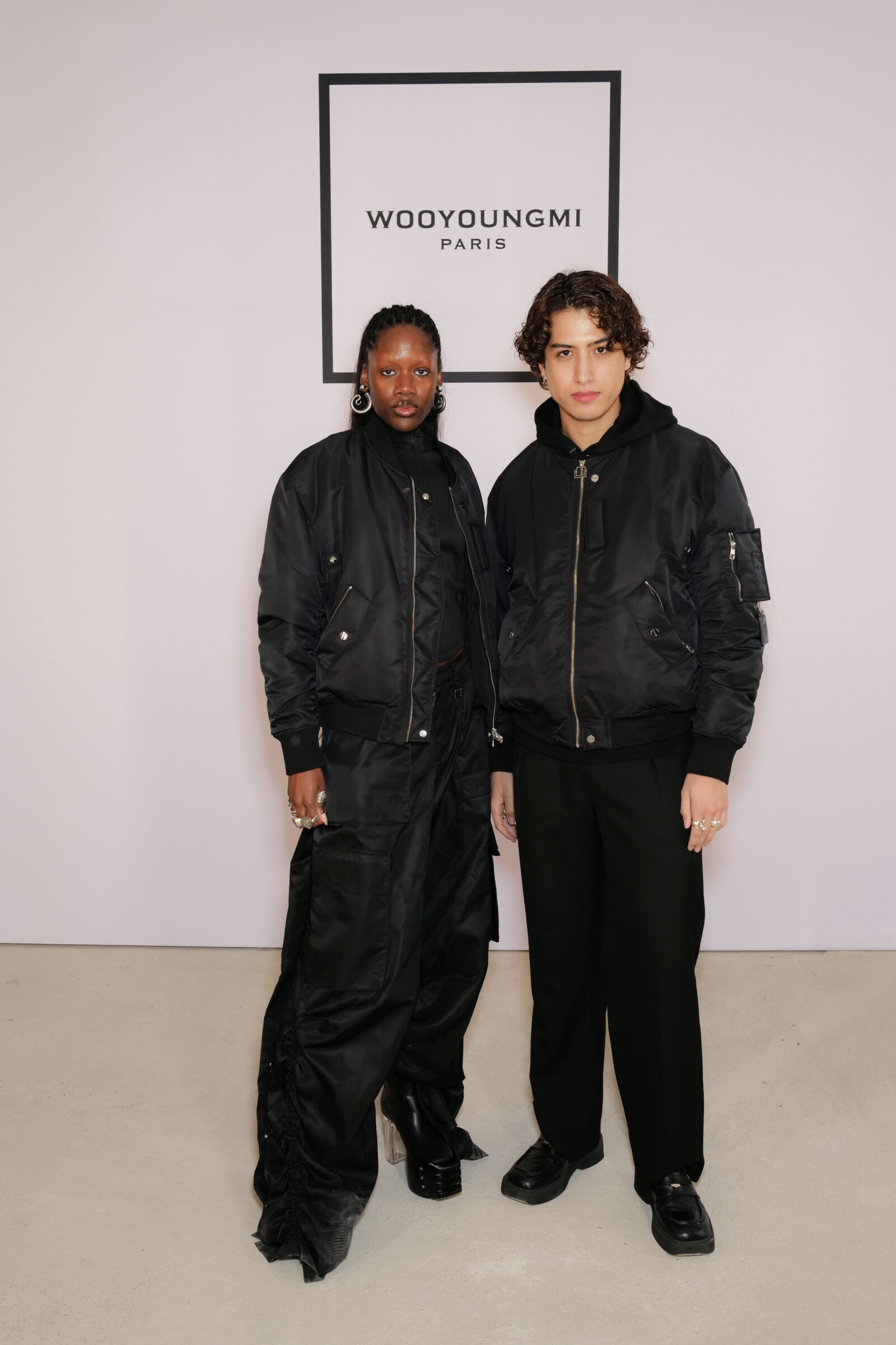 Oyinda and Kemio, fashionable guests at the Wooyoungmi FW24 show.