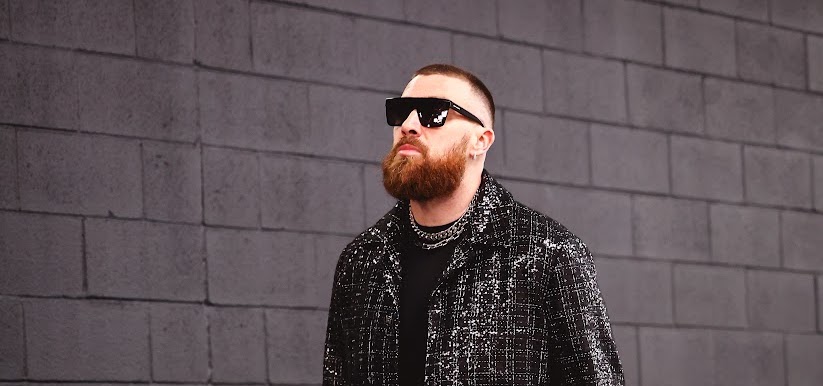 Kansas City Chiefs’ Travis Kelce Captivates in Custom AMIRI Attire at Super Bowl LVIII