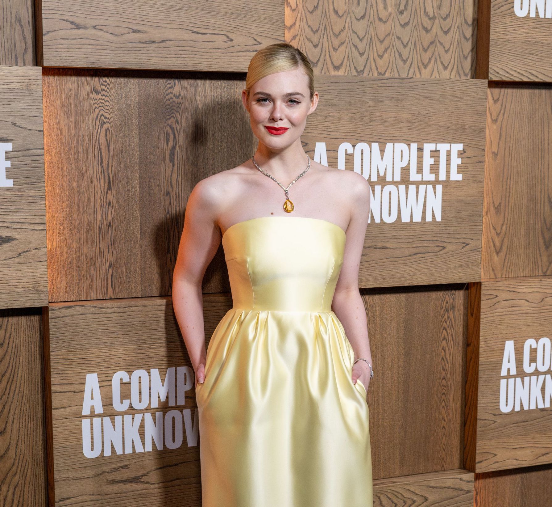 Elle Fanning Channels Old Hollywood In Custom Prada At ‘A Complete Unknown’ Premiere