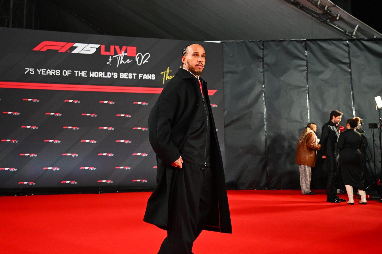 Lewis Hamilton of Great Britain and Scuderia Ferrari poses for a photo as he attends F1 75 Live 