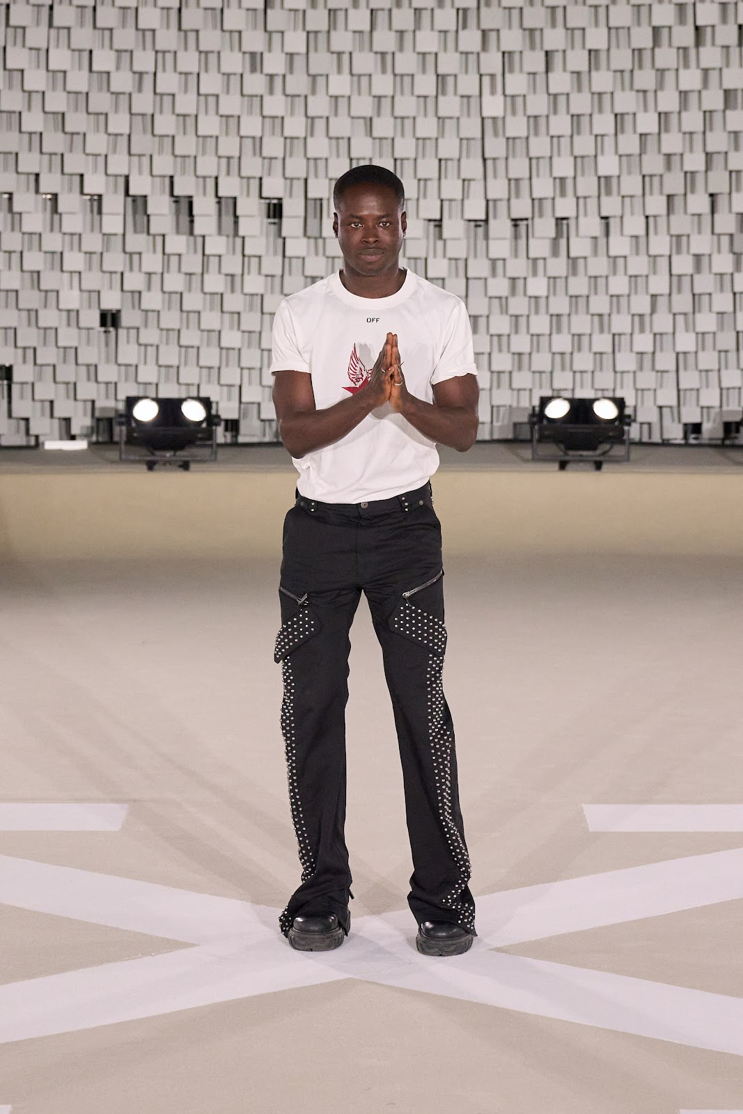 Off-White™ creative director Ib Kamara takes a bow at the close of the FW25 presentation during Paris Fashion Week (Image courtesy of Off-White)