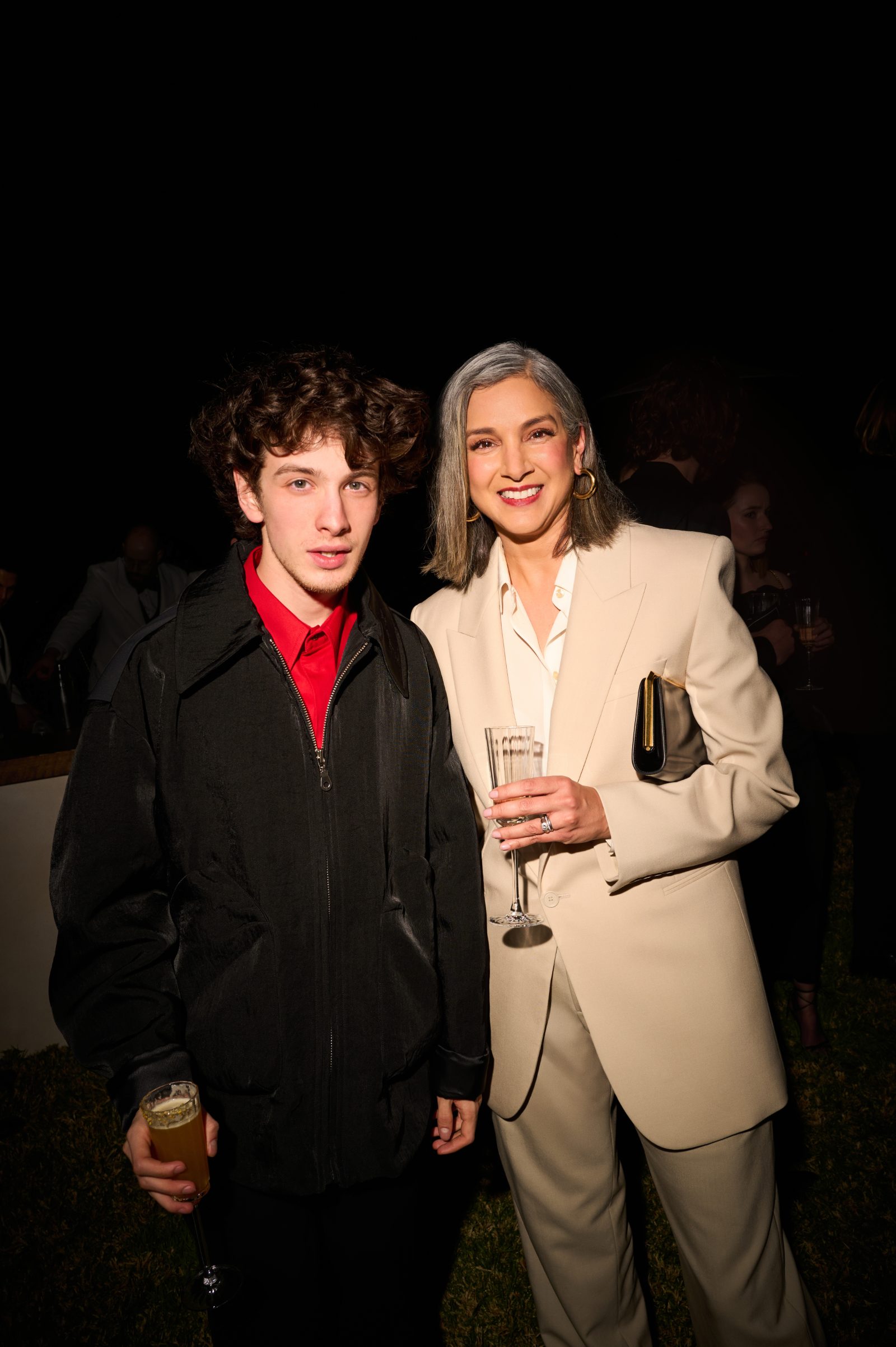 Mark Eydelshteyn and Radhika Jones sharing a moment at the Saint Laurent x Vanity Fair pre-Oscar dinner in Hollywood Hills. (Photo courtesy of Saint Laurent)